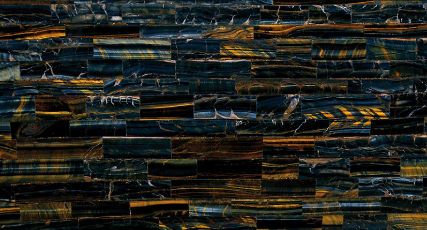 A close up of a brick wall with a marble texture.