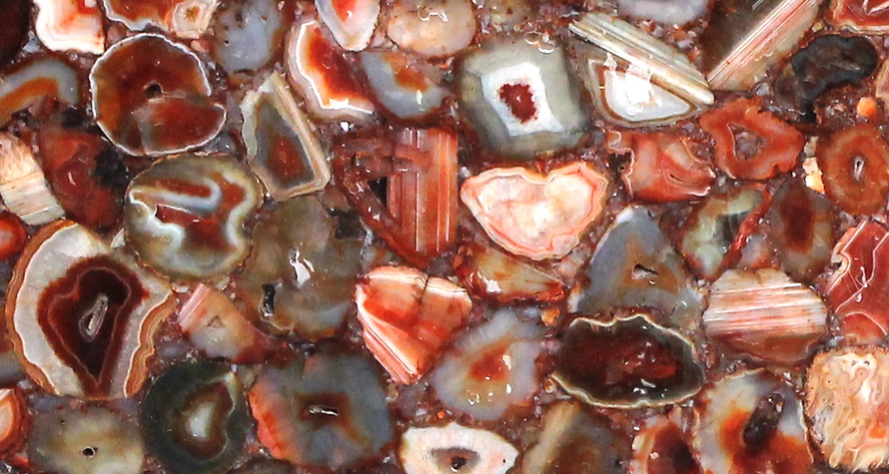 A close up of a pile of red and white stones