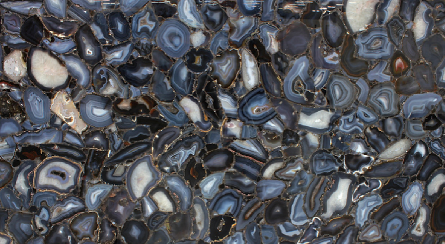 A close up of a marble counter top with a lot of stones on it.