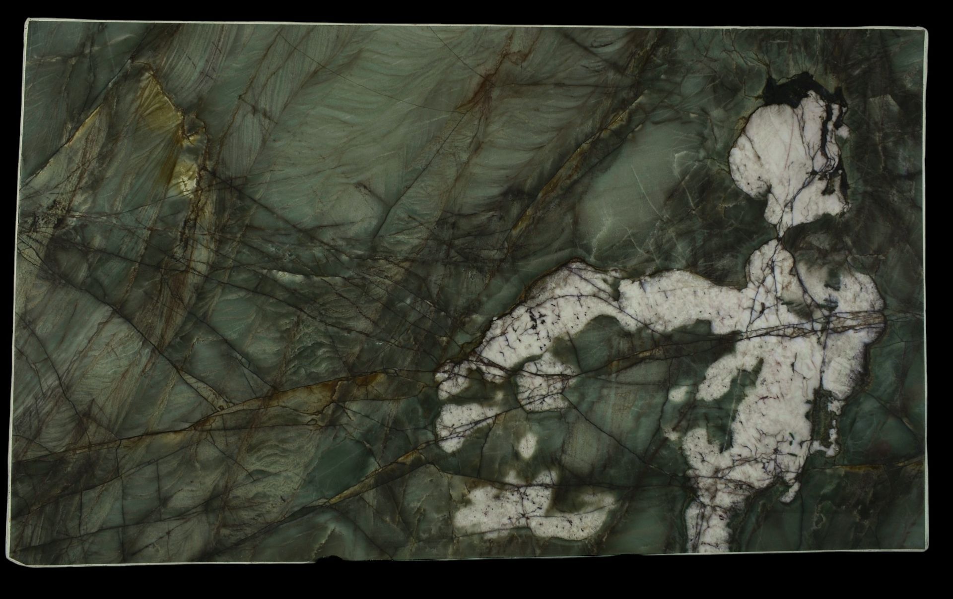 A close up of a green marble slab on a black background.