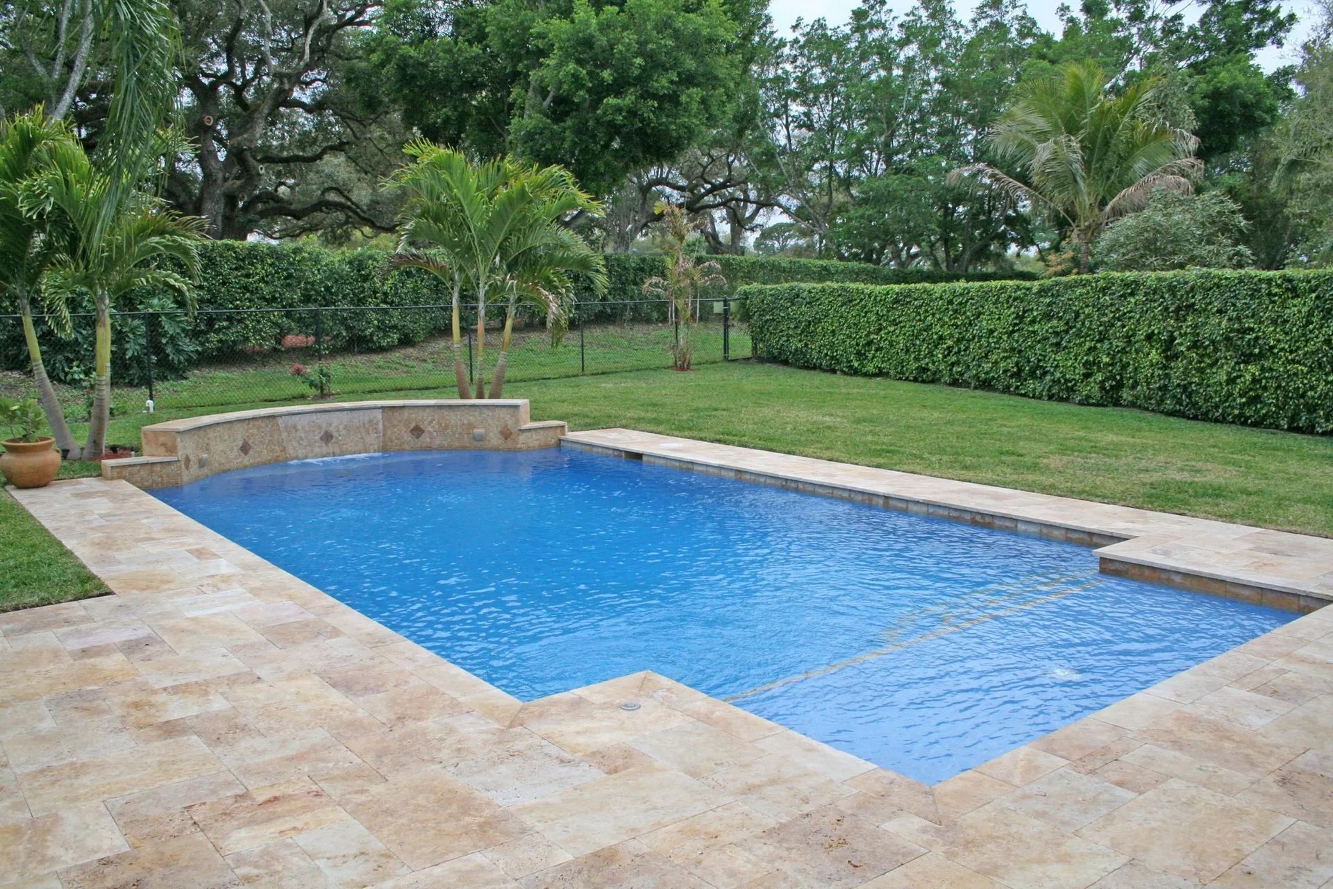 Travertine tiles around the pool