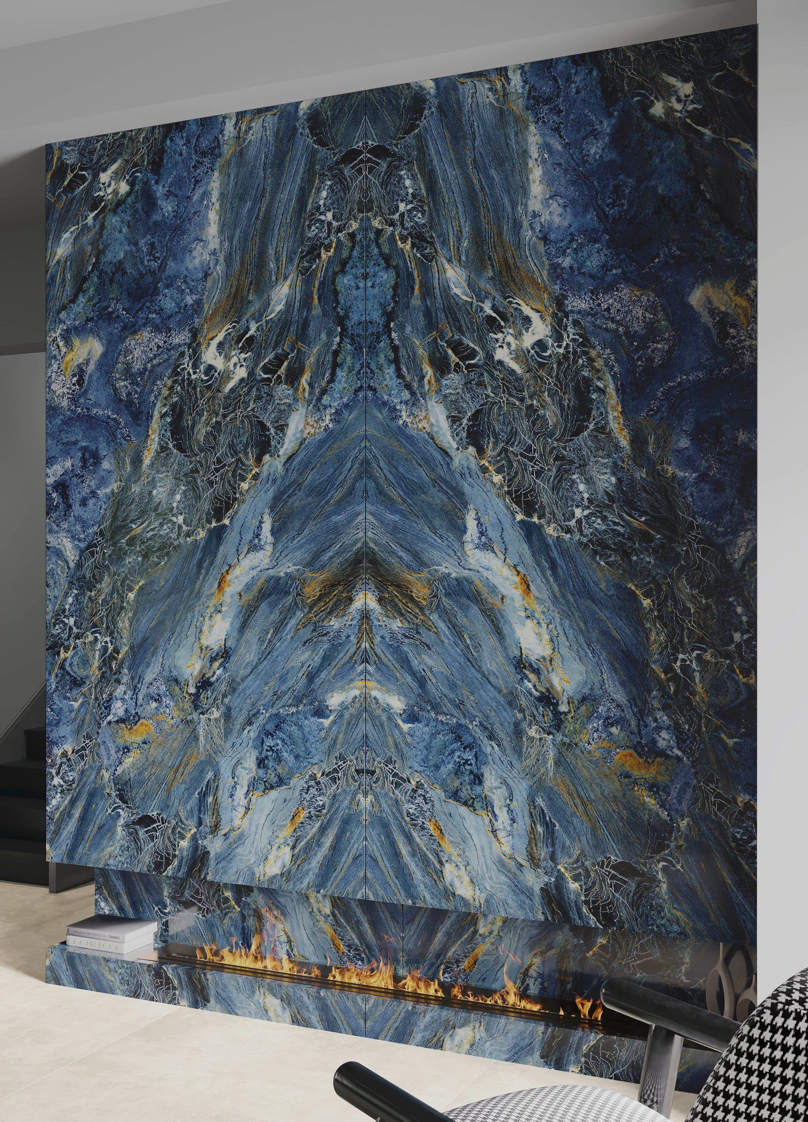 Blue marble fireplace with gold accents and a geometric design.