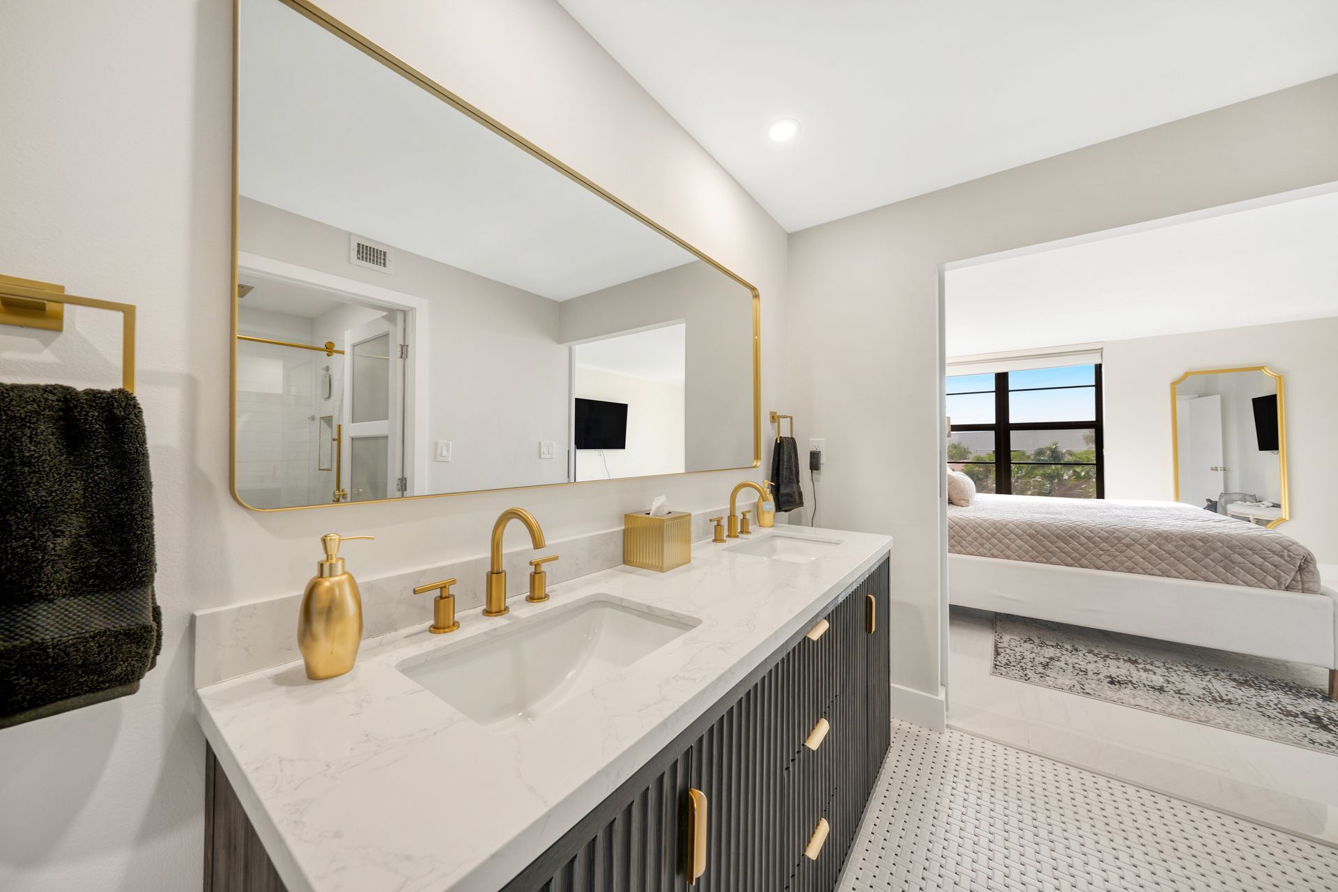 A bathroom with a double sink and a large mirror.