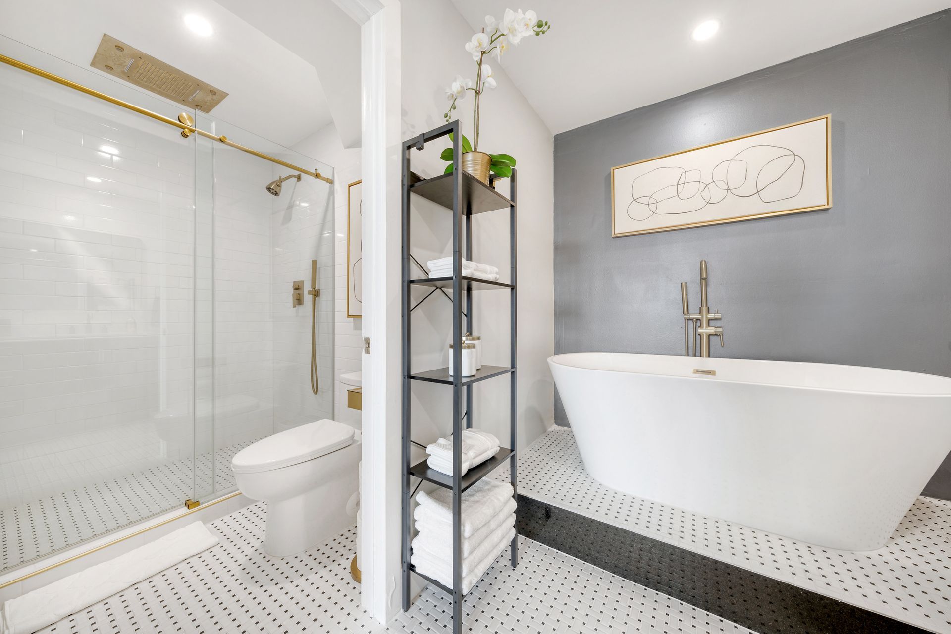 A bathroom with a tub , toilet and shower.