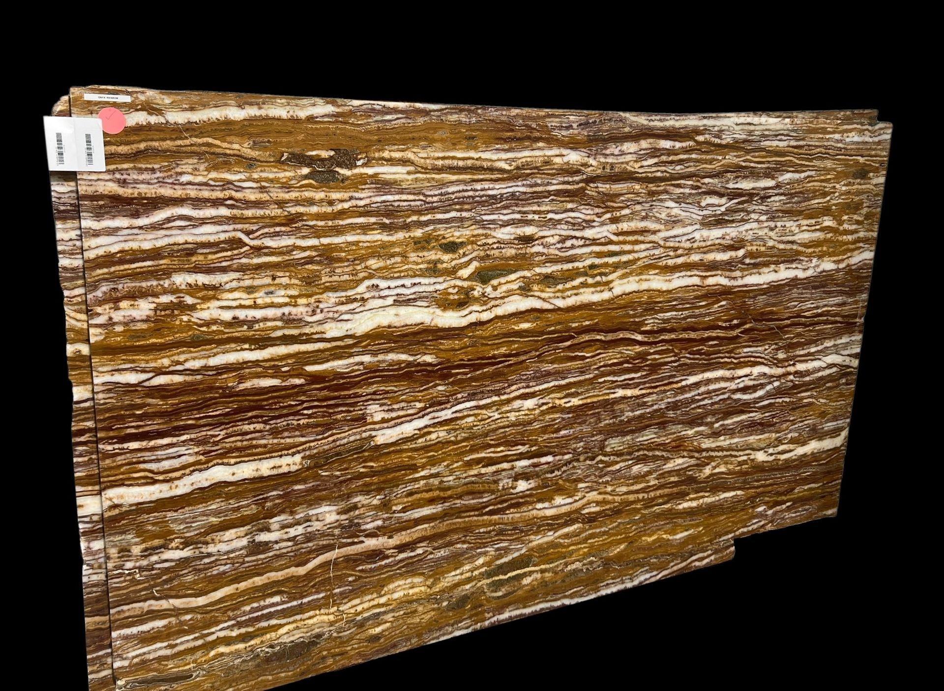 A close up of a piece of wood on a black background.