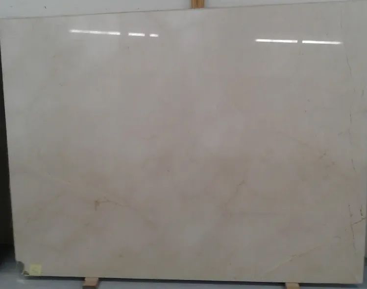 A large white tile is sitting on a wooden pallet