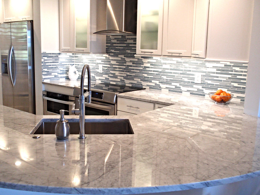 A kitchen with stainless steel appliances and granite counter tops