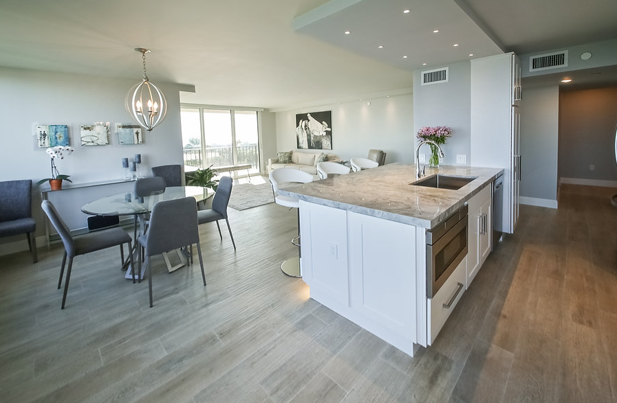 A kitchen with a large island in the middle of the room.