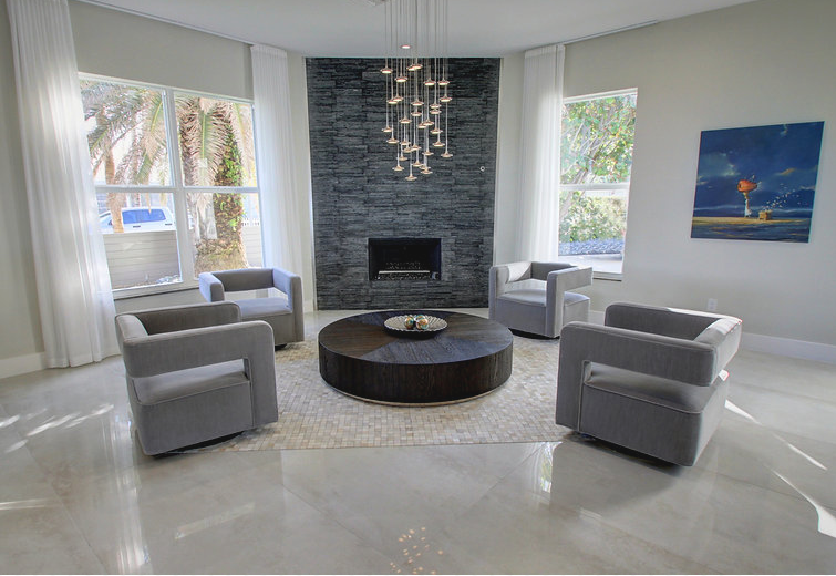 A living room filled with furniture and a fireplace.