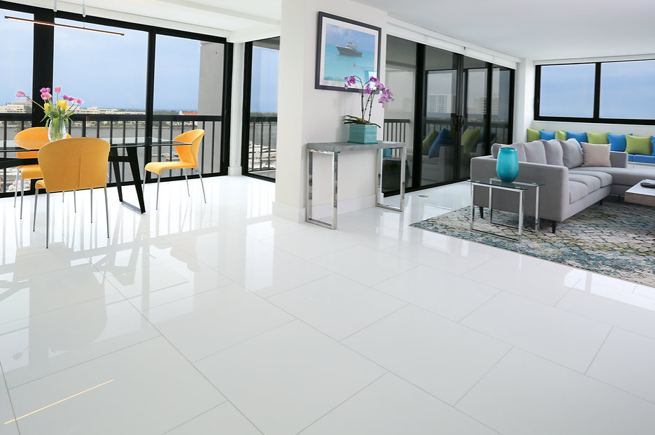 A living room with a couch and a table and chairs