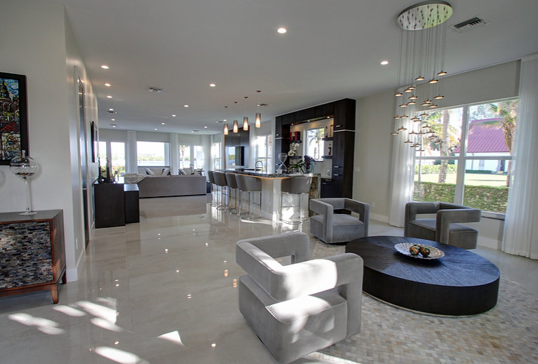 A living room with a lot of furniture and a table.