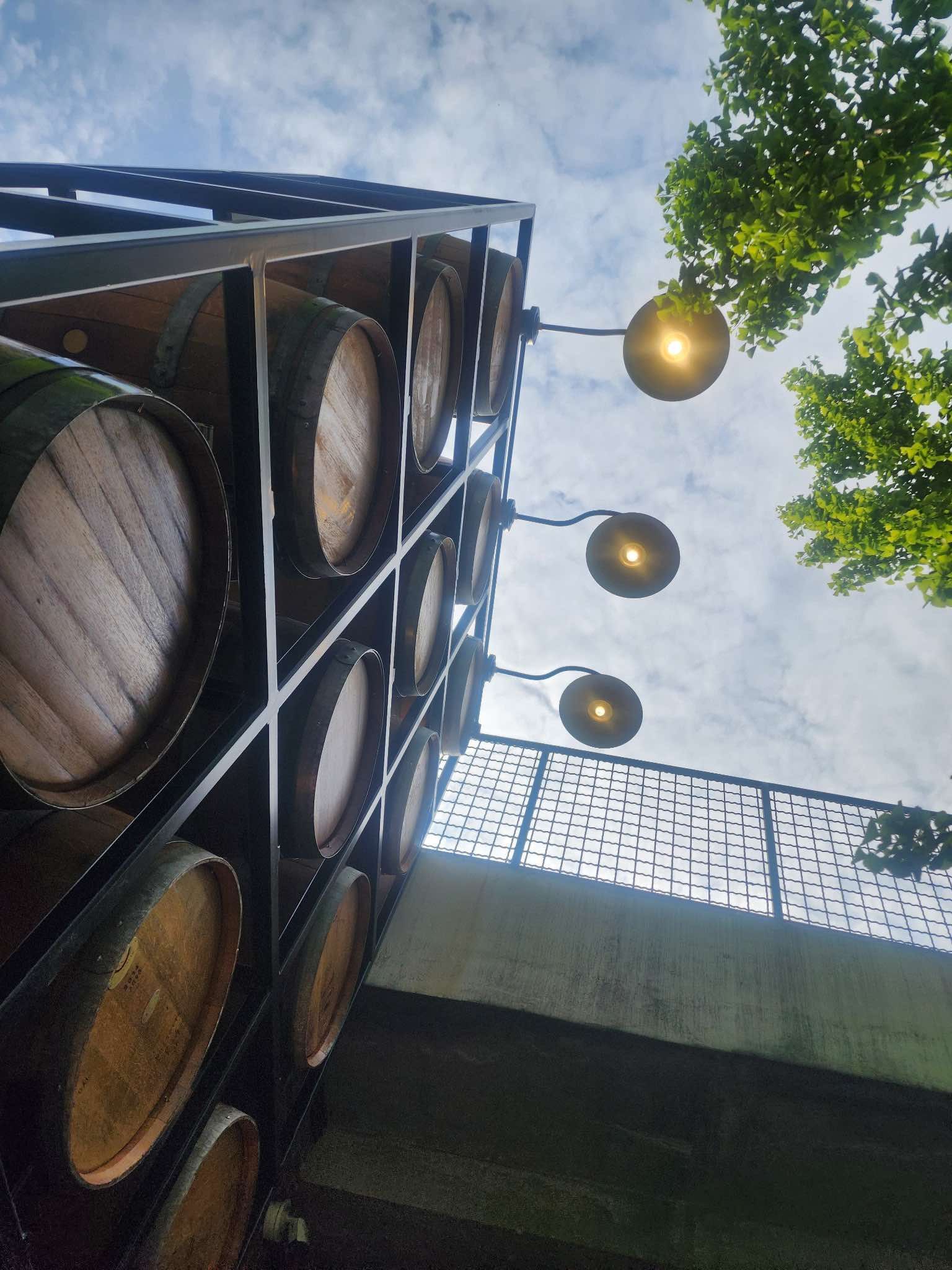 A man is standing on a ladder working on a ceiling.