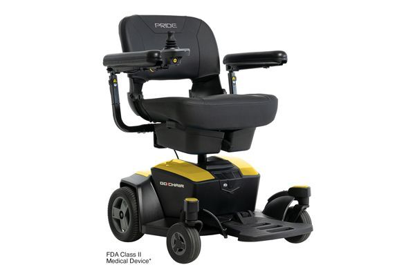 A yellow and black Pride Go-Chair power wheelchair with an armrest joystick, isolated against a white background.