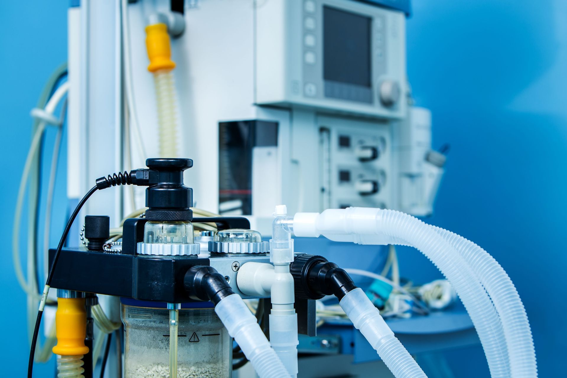 Medical equipment with tubing and a control panel in a clinical setting