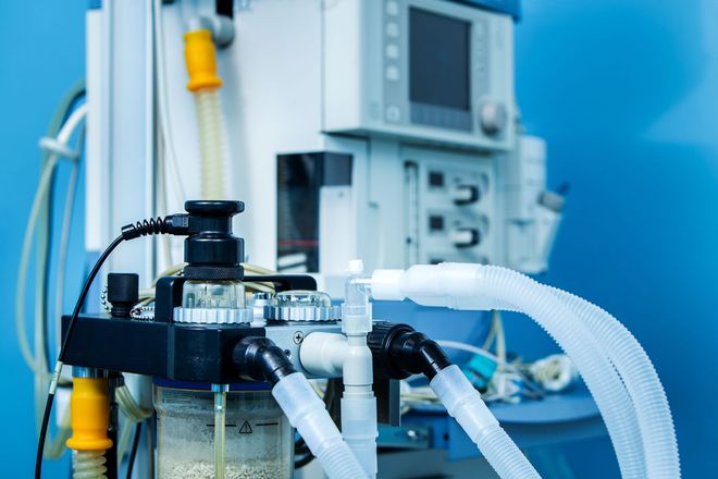 Medical equipment with tubing and a control panel in a clinical setting