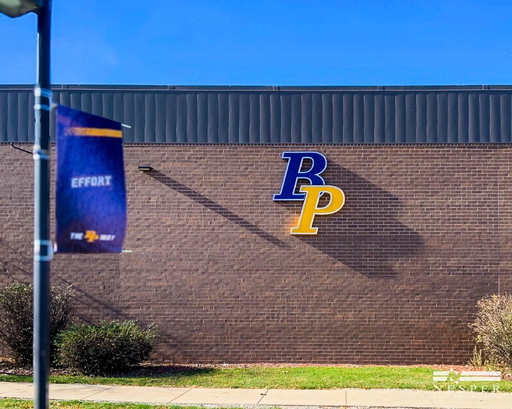 Brick building with a blue and gold