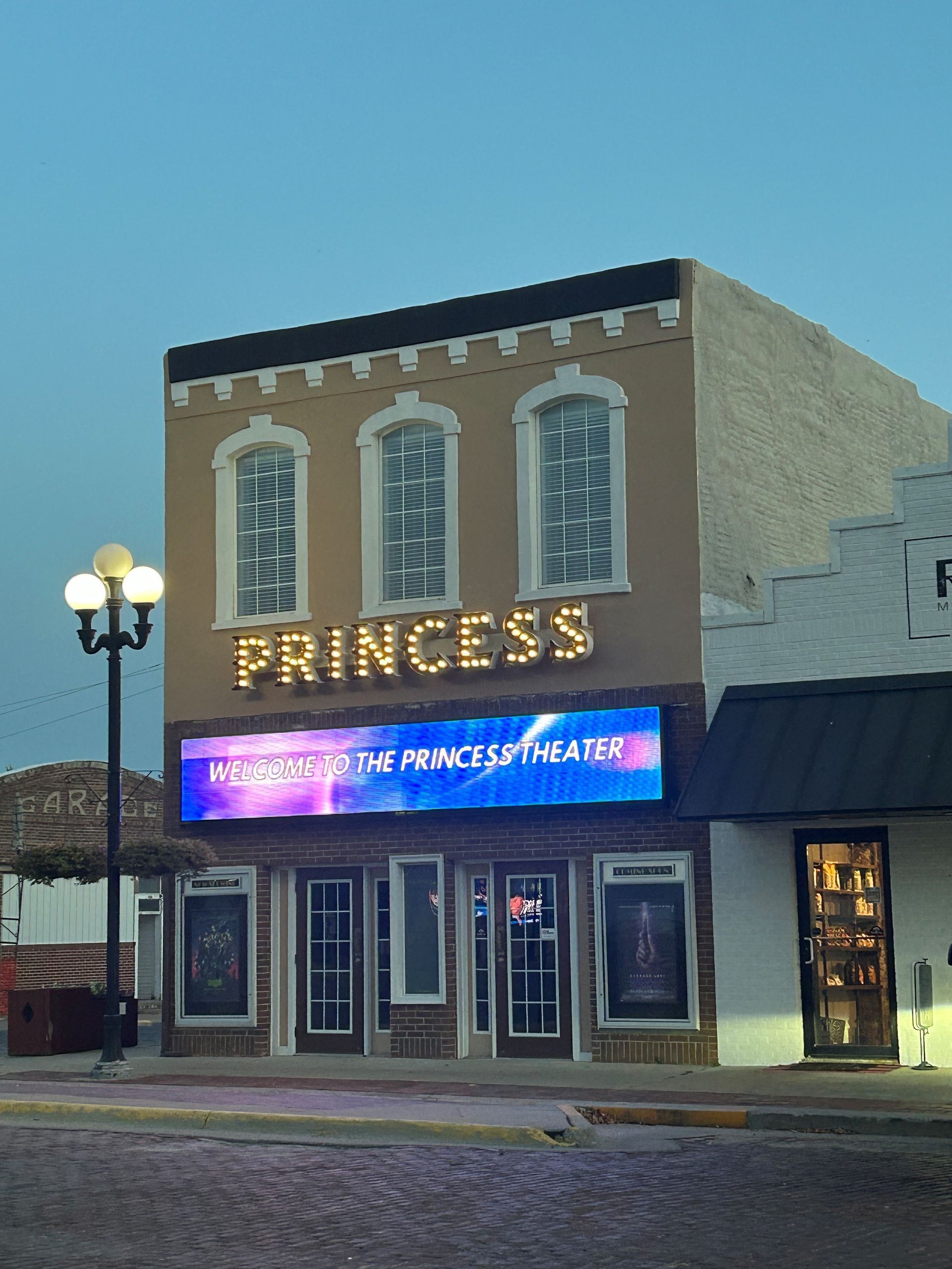 Princess Theater: Tan building with lit 