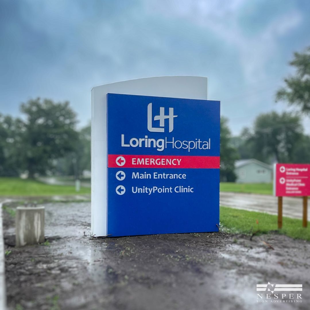 A blue and white sign for Loring Hospital.