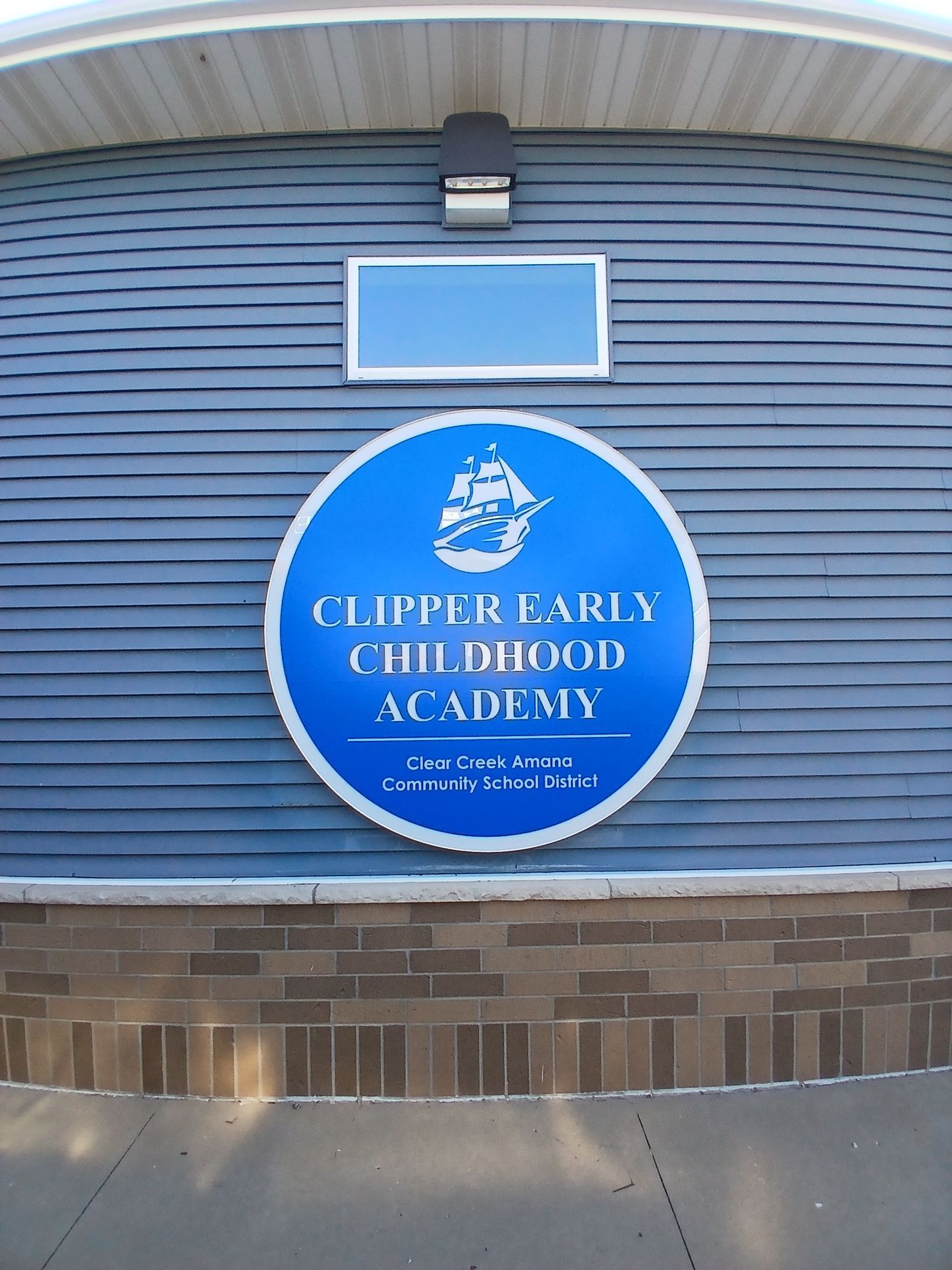 A door that says clipper family childhood academy on it
