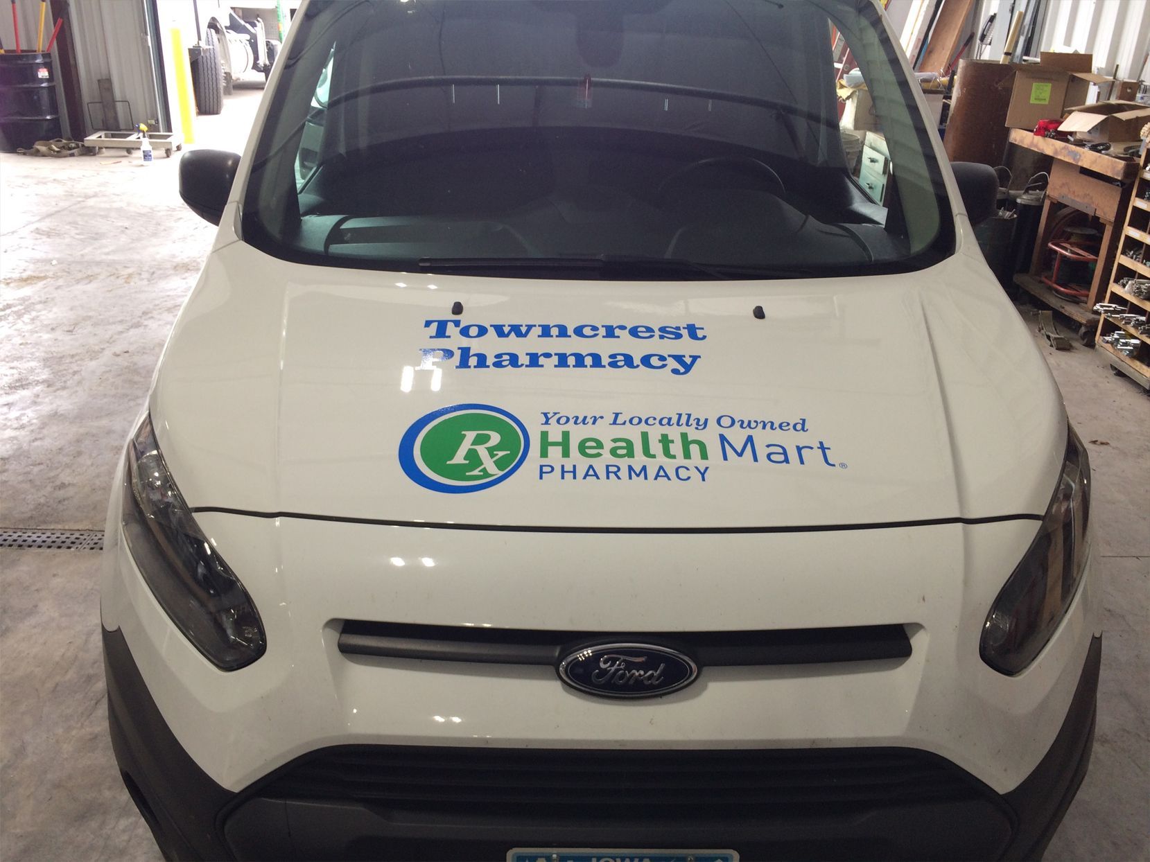 White van with 'Towncrest Pharmacy' and 