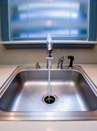 Kitchen sink with water running