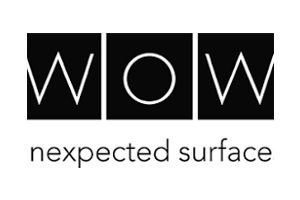 Black logo with three square panels reading “w o w” above the words “unexpected surface”