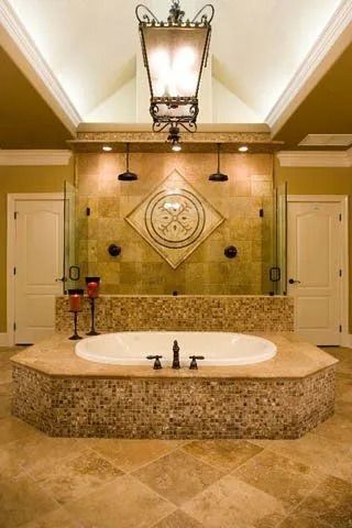 Elegant bathroom with a large stone vanity, oval sink, wall mirror, and warm lighting.