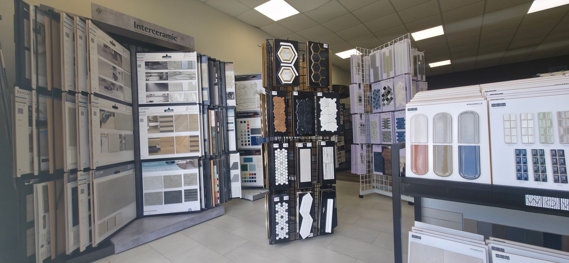 Store aisle with stacked boxed appliances and electronics displays on both sides