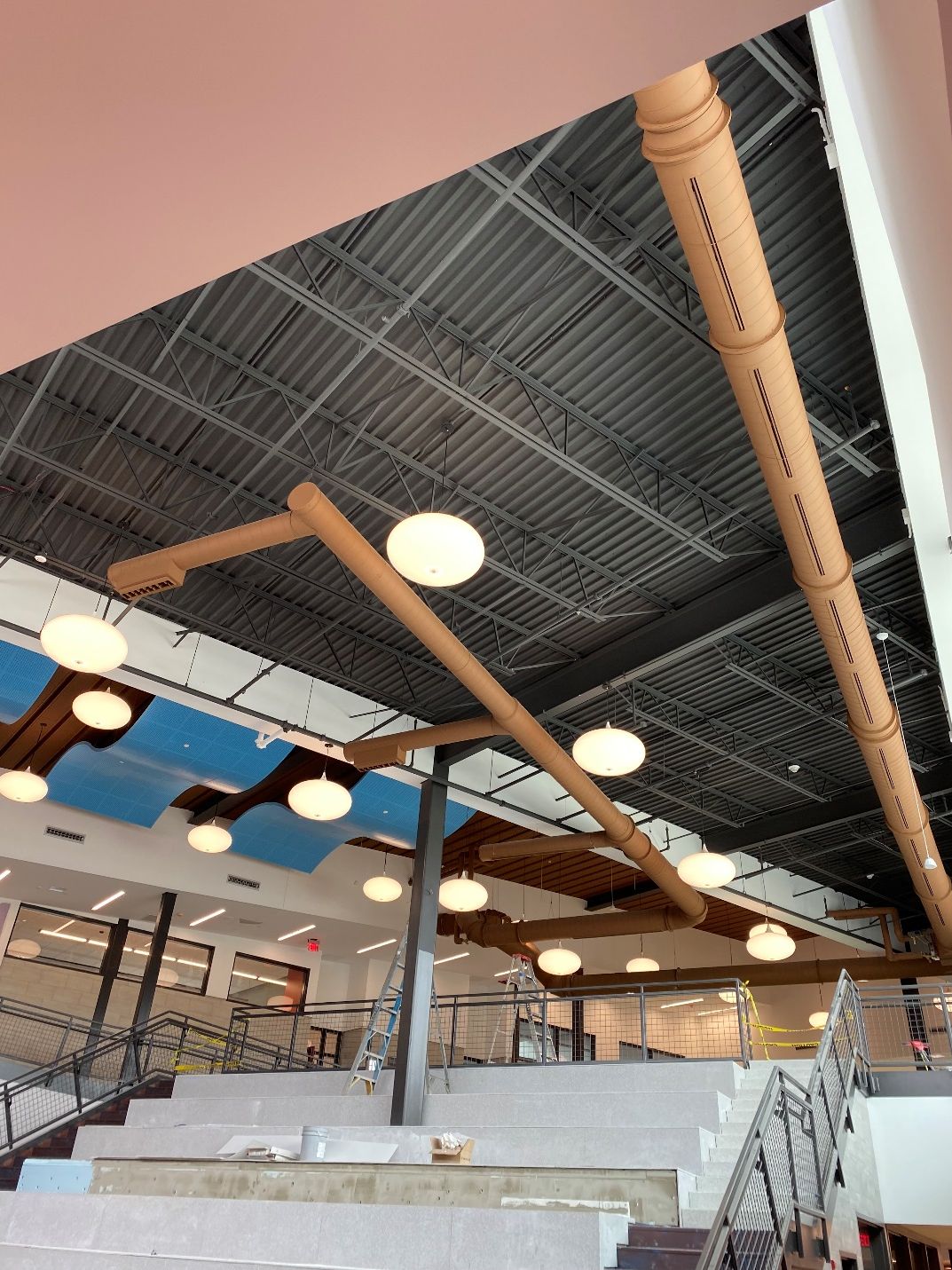 A building with a lot of pipes hanging from the ceiling