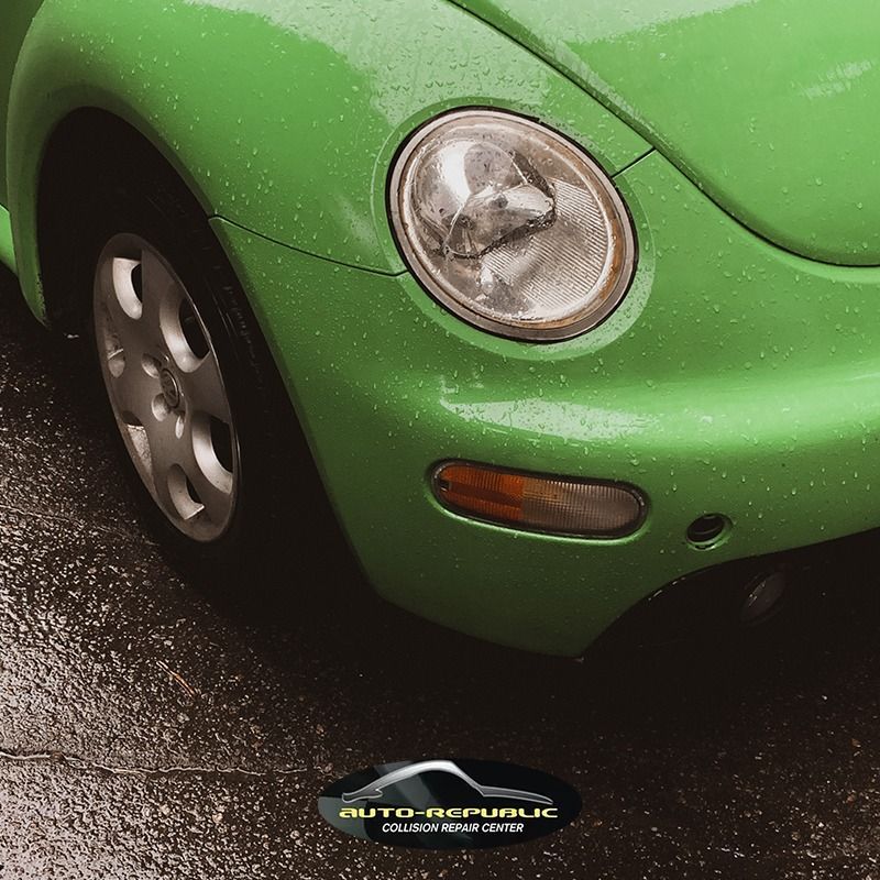 A green car with the word auto republic on the bottom