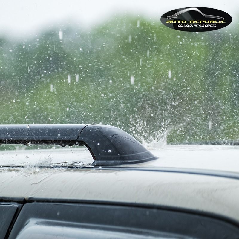 A close up of a car 's roof in the rain