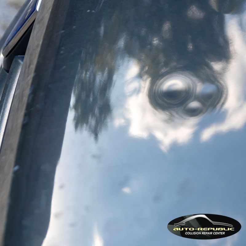 A close up of a car windshield with a logo for auto-high-public