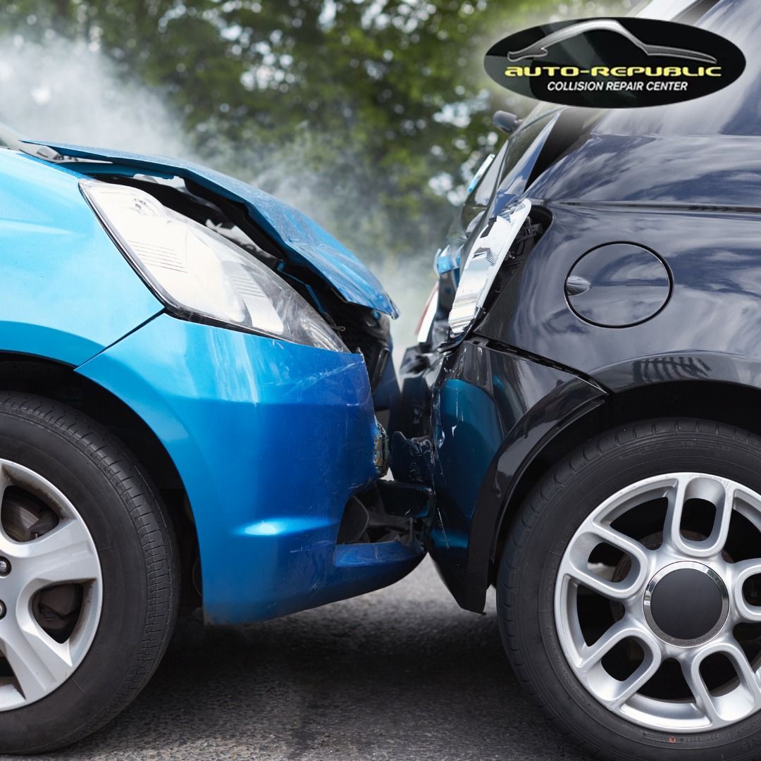 A blue car and a black car are crashed into each other