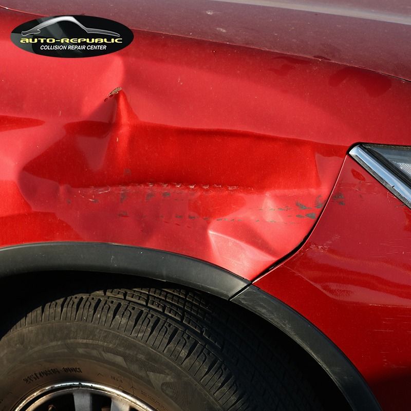 A red car with a sticker that says auto republic