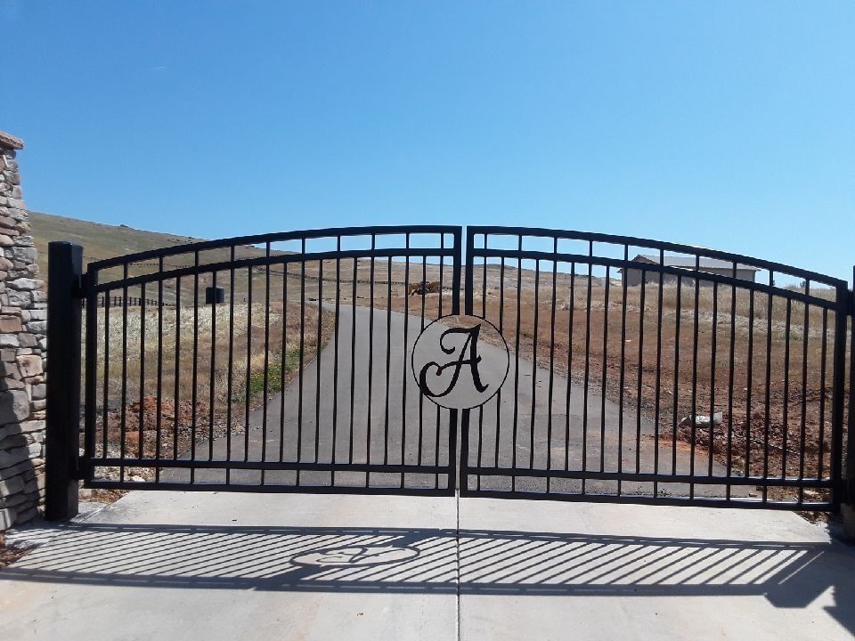 Black metal entrance gate with an 