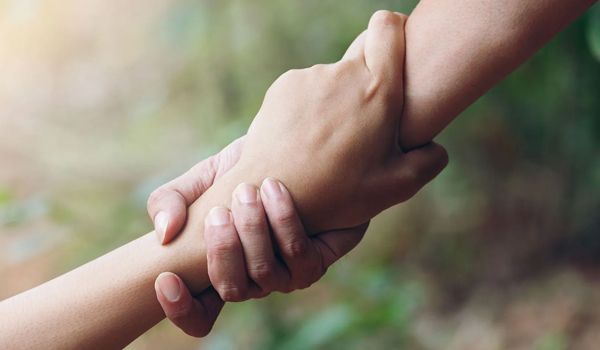A group of people with disabilities are posing for a picture.