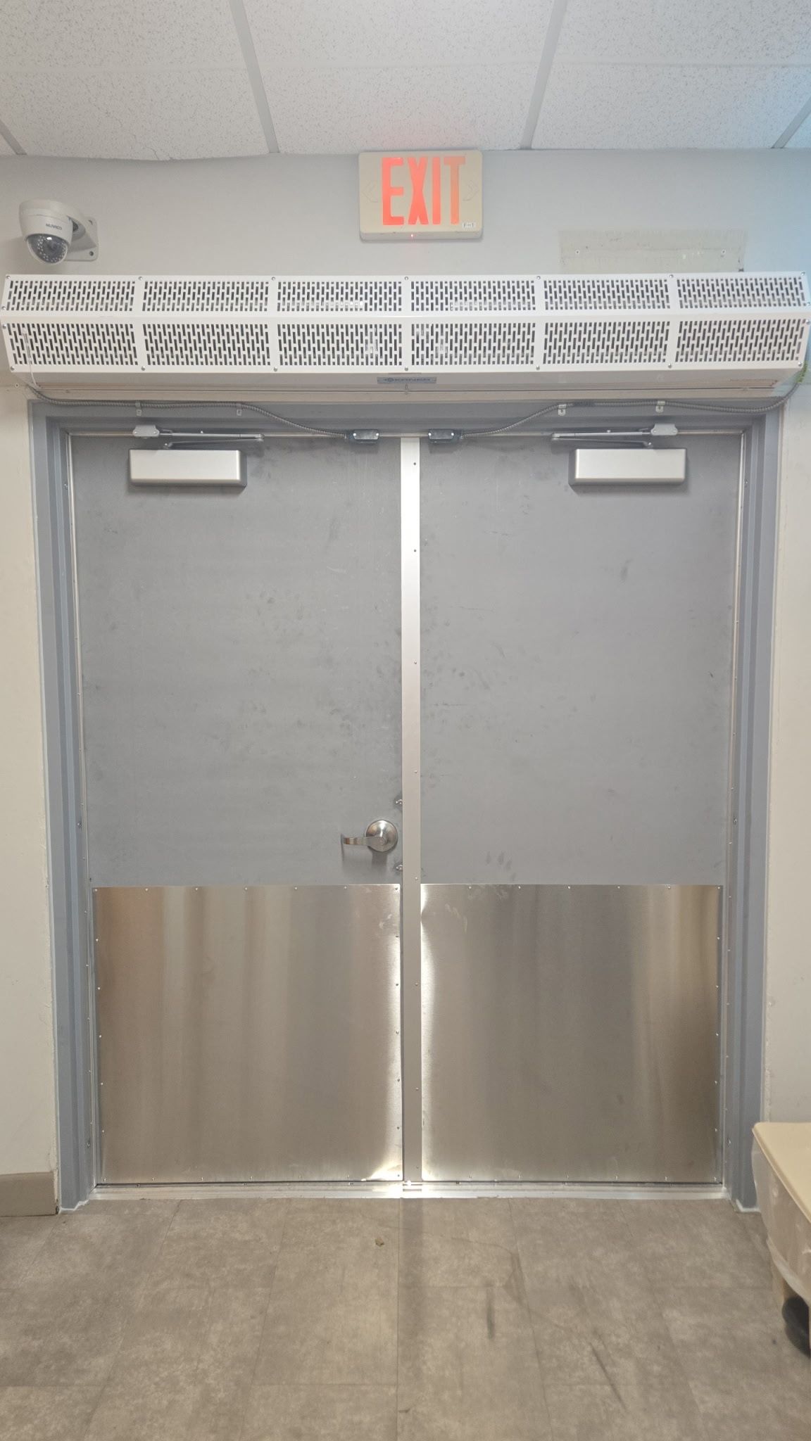 Double metal doors with stainless steel lower panels, 