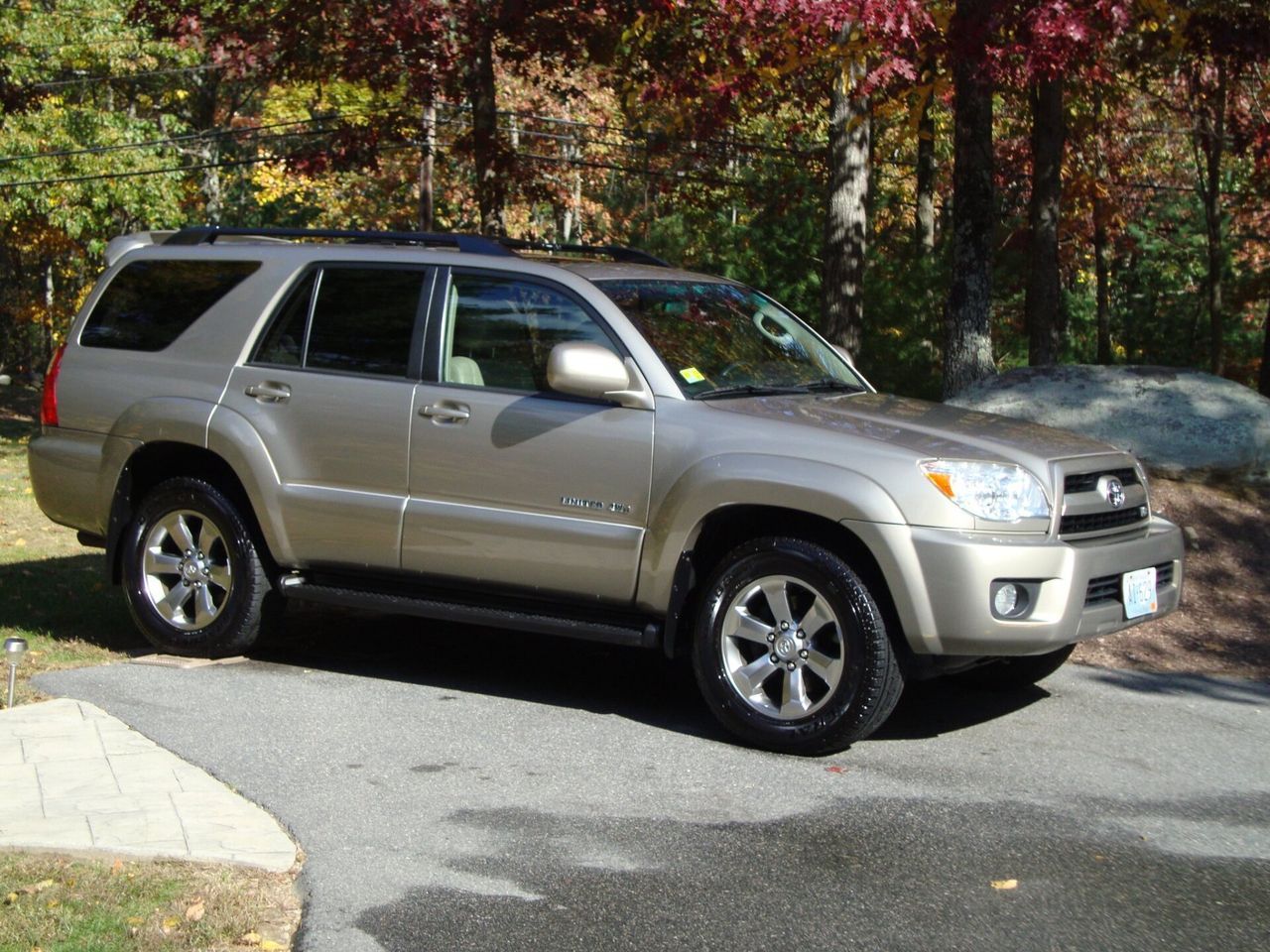A toyota 4runner is parked on the side of the road