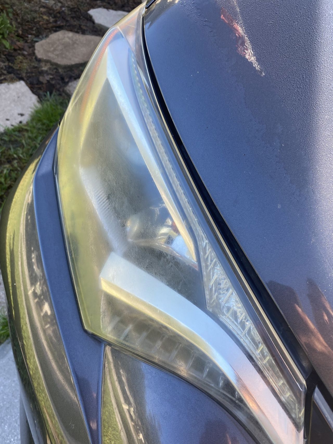 A close up of the headlight of a car