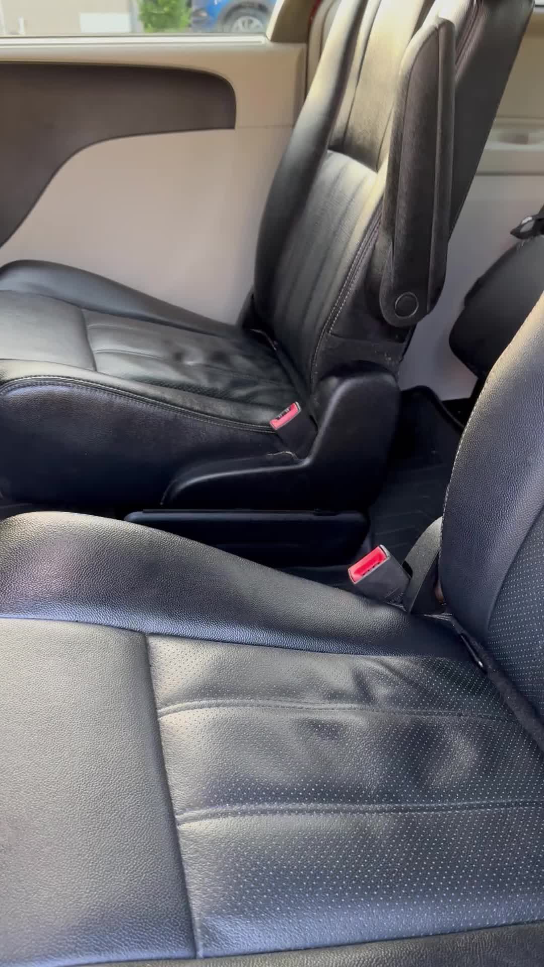 A close up of the back seats of a car.