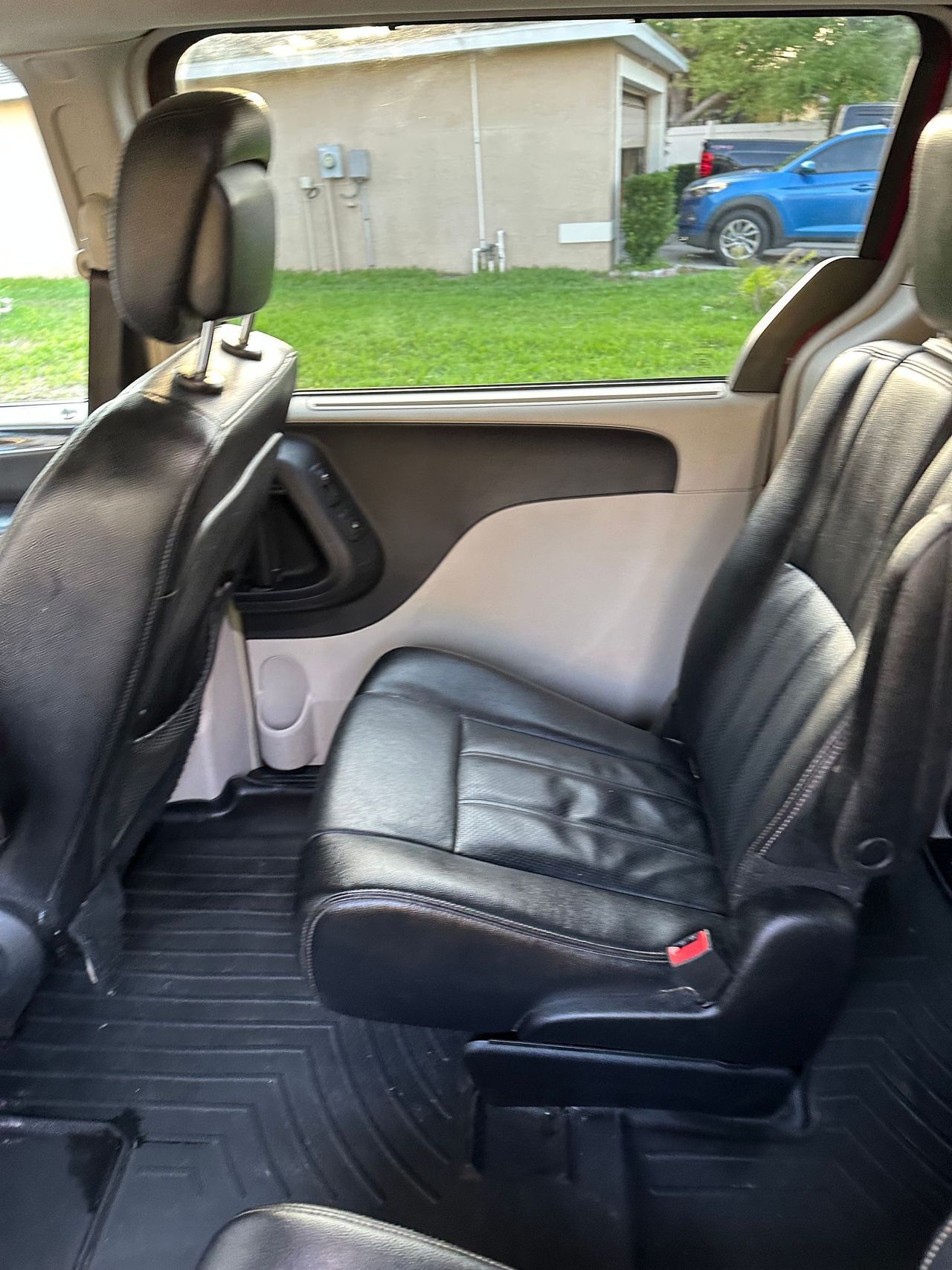The back seats of a minivan are empty.