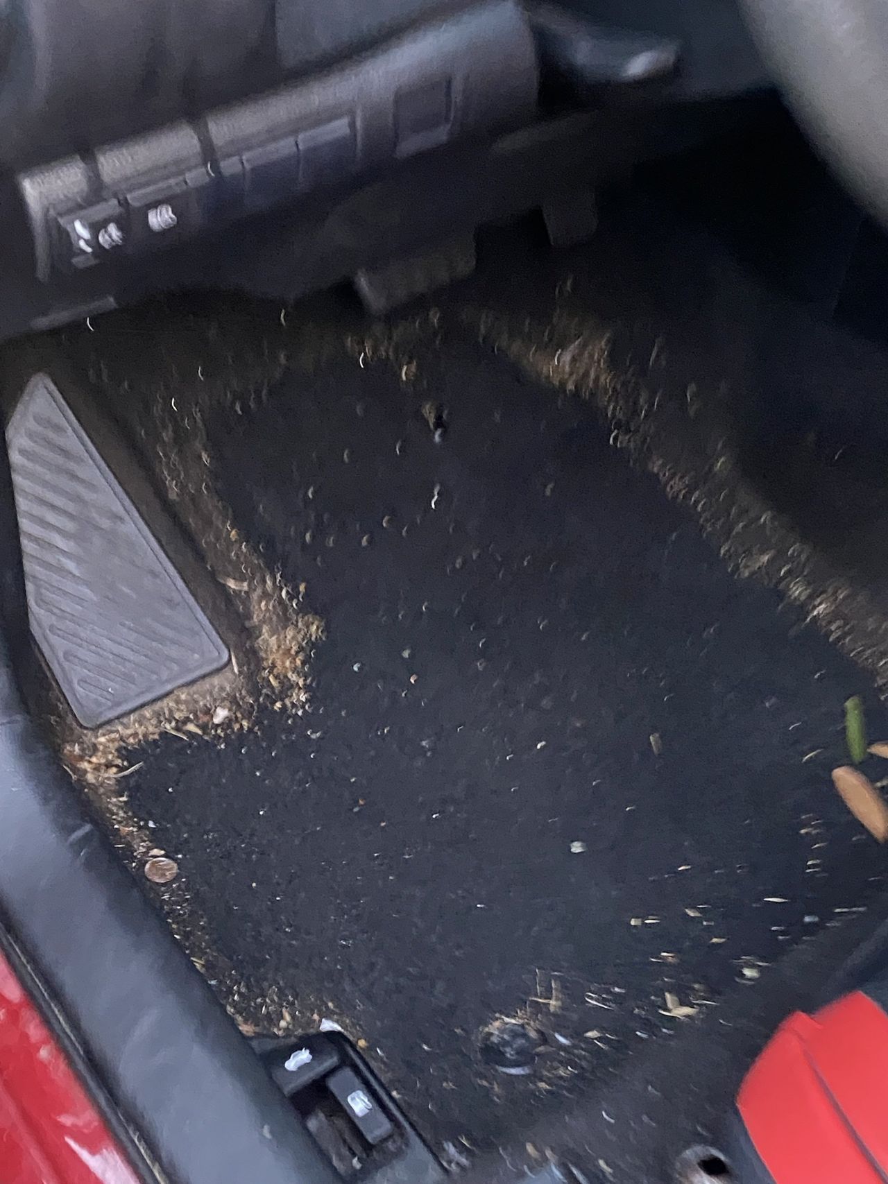The inside of a car with a dirty floor