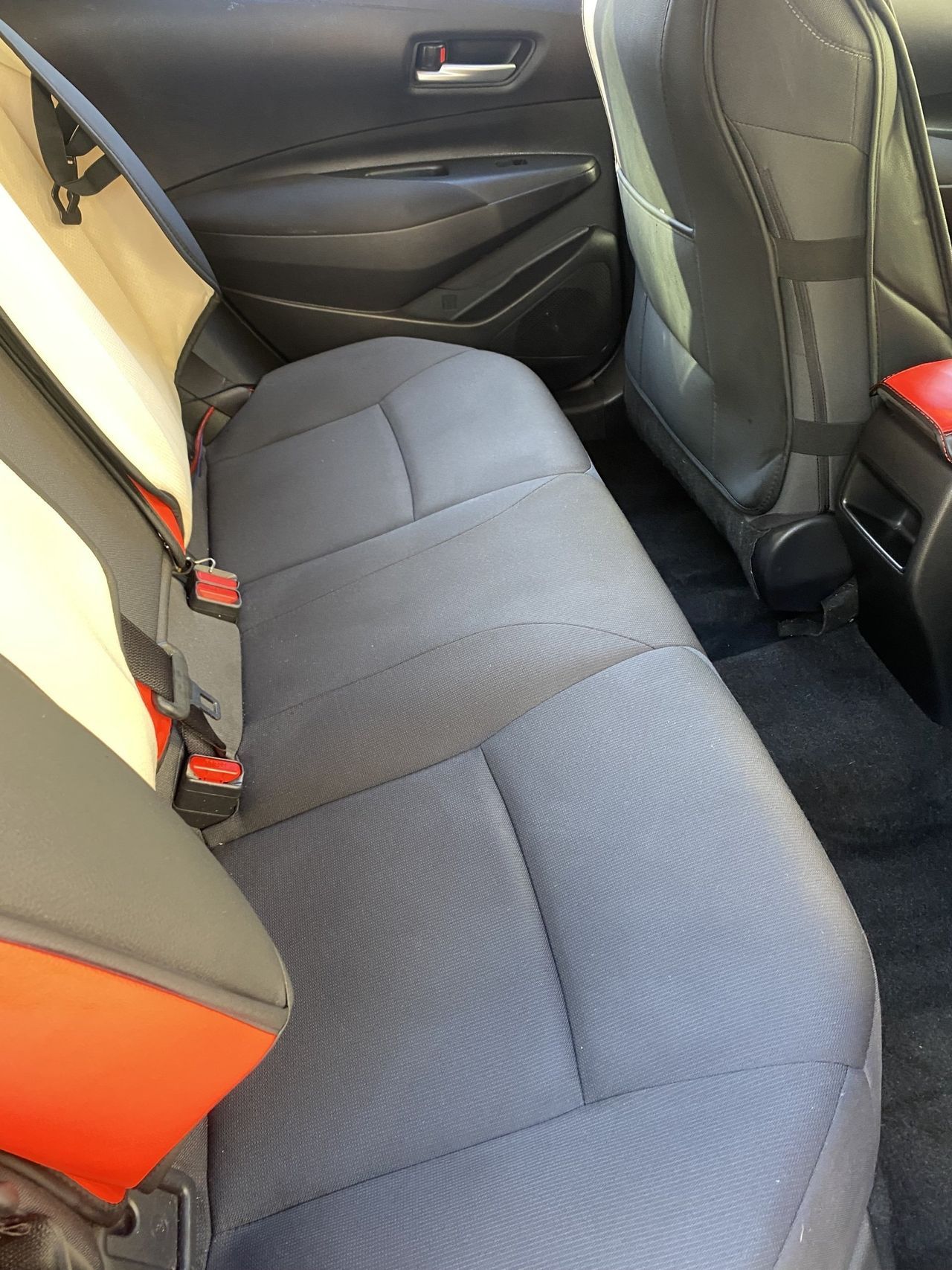 A close up of the back seat of a car.