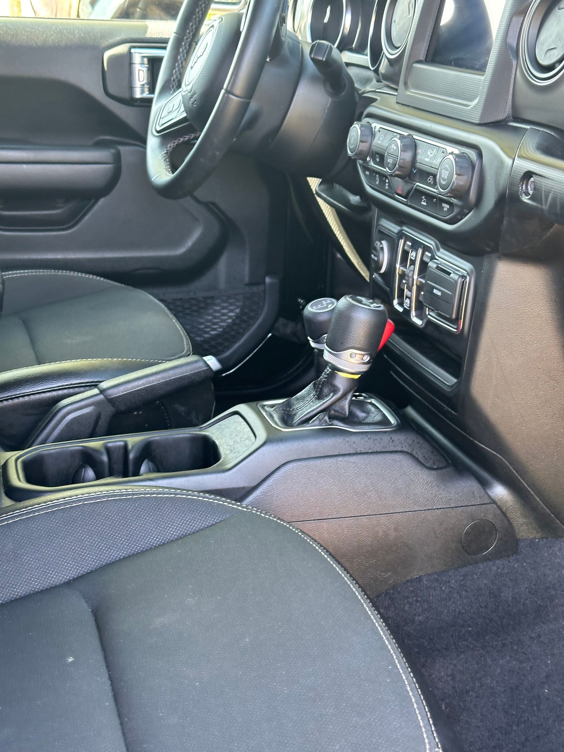 A close up of the interior of a jeep wrangler.