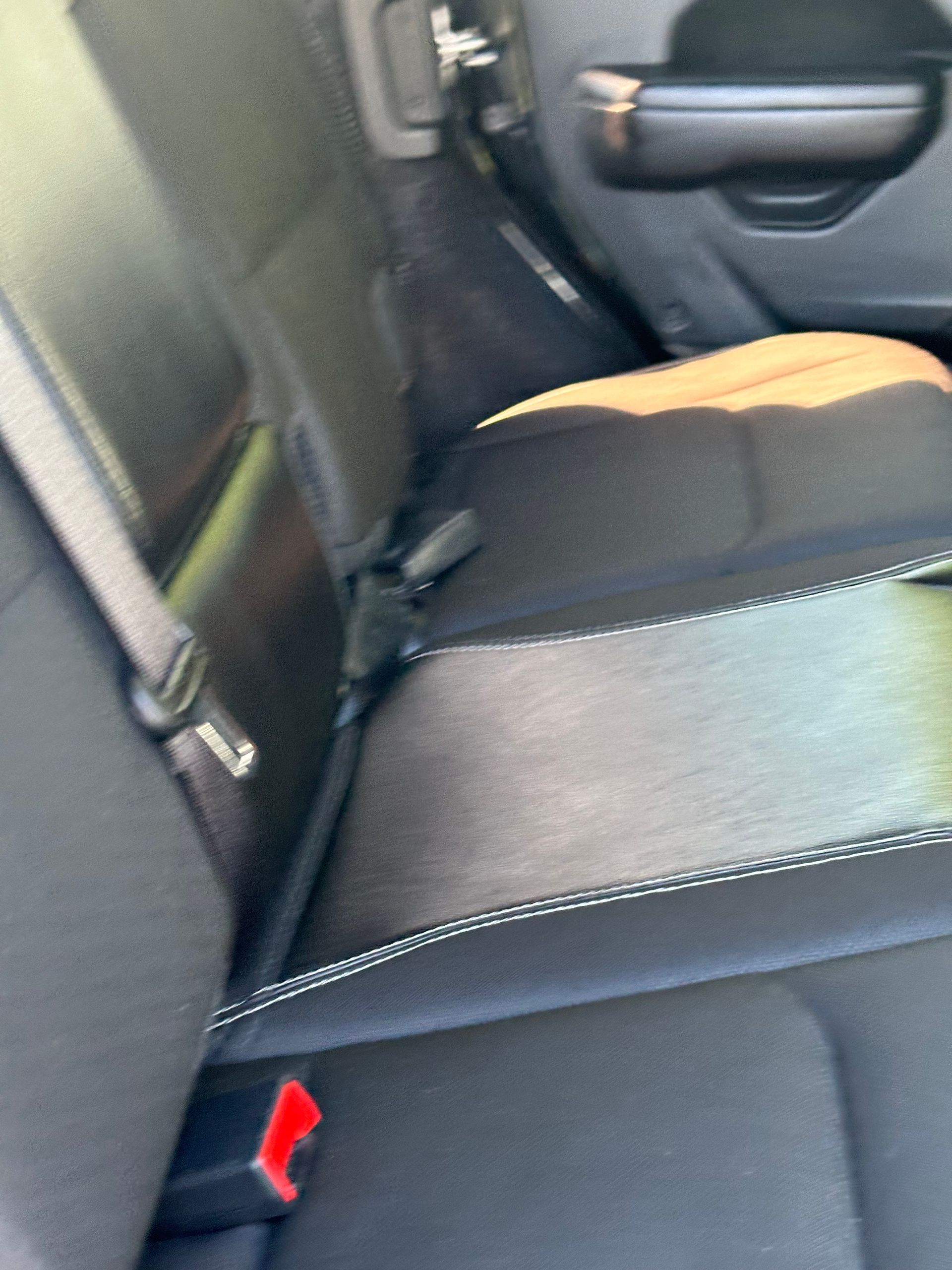 A close up of the back seat of a car
