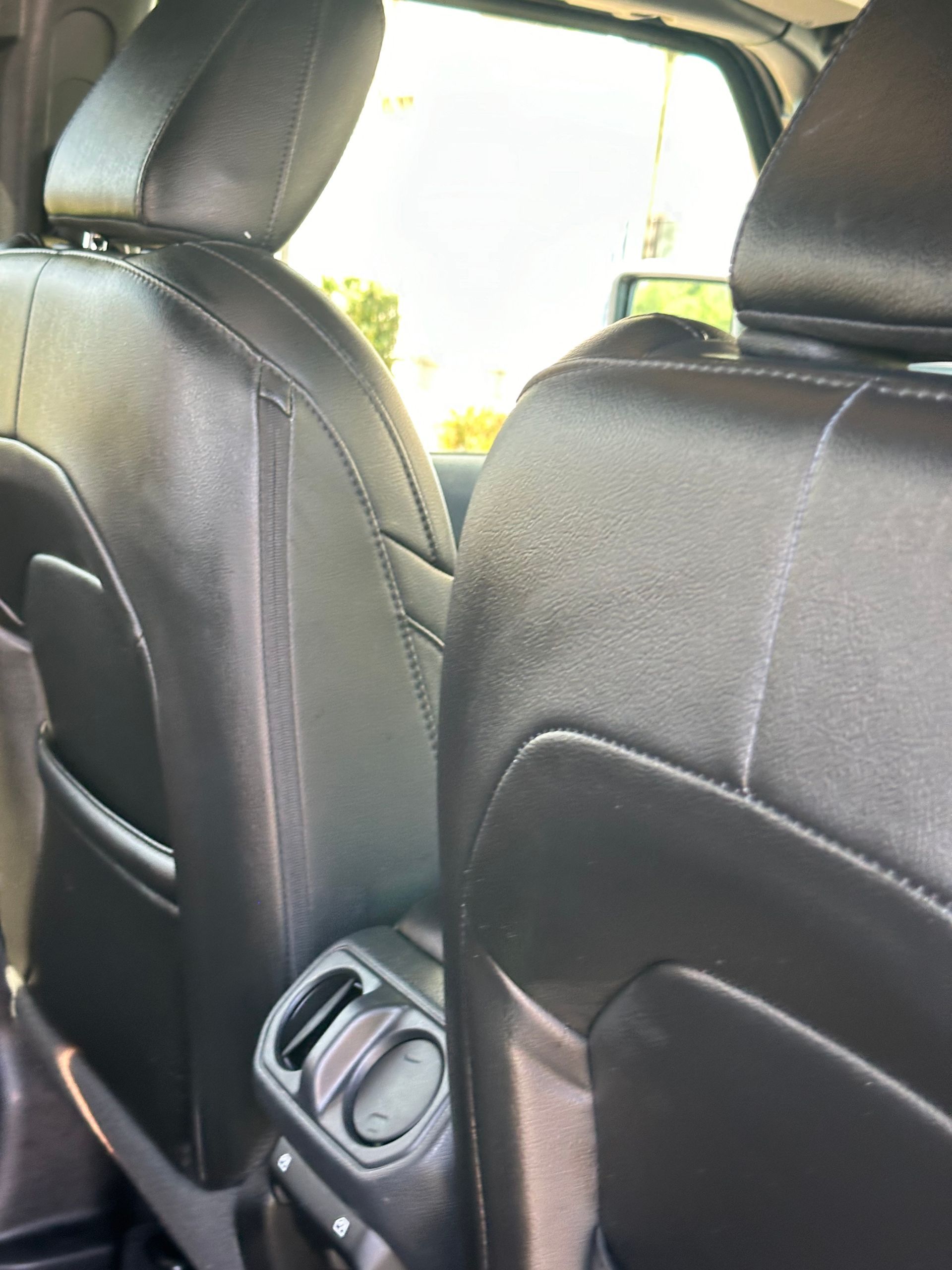A close up of the back seats of a car