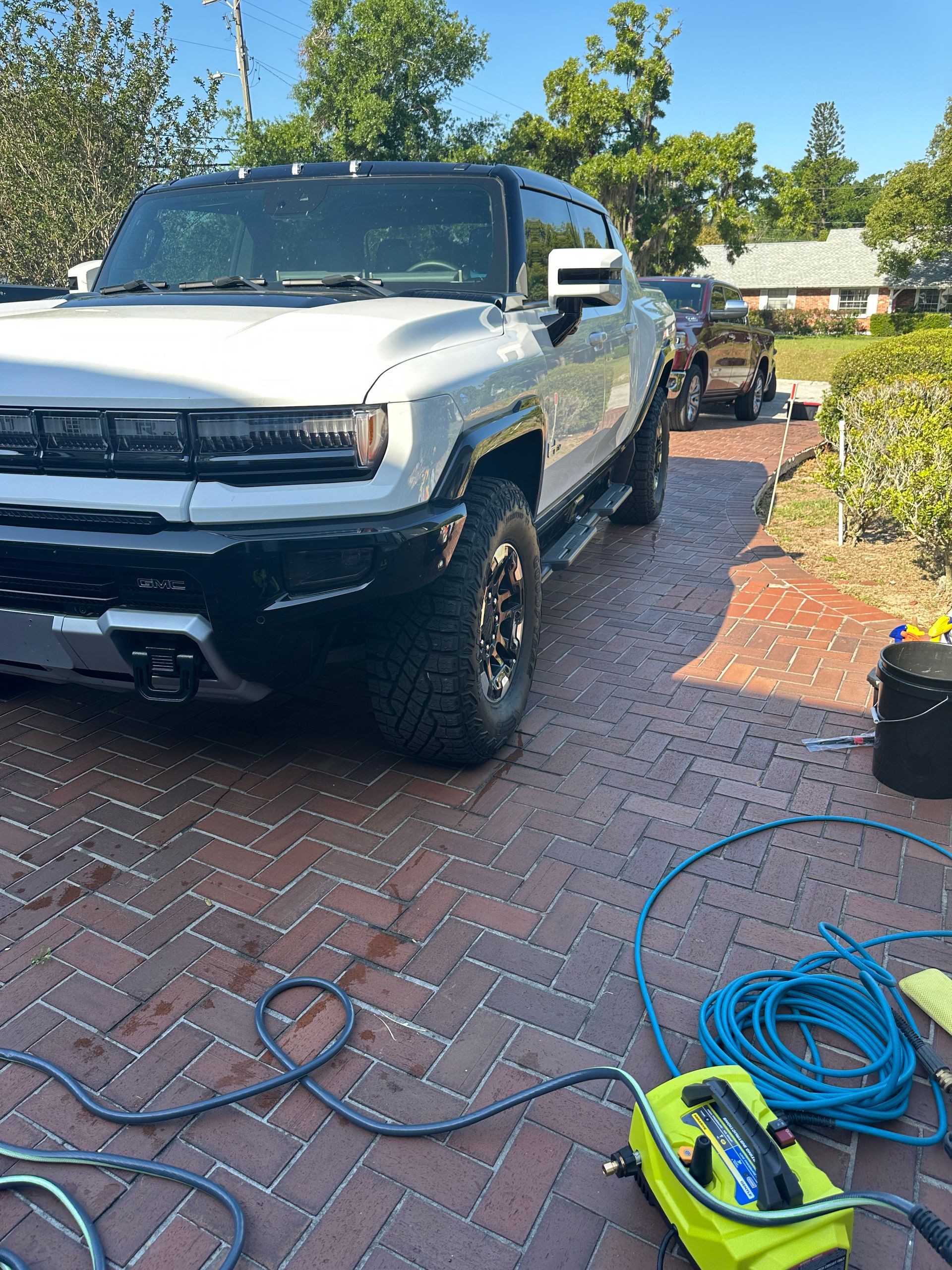 Drivers front corner of a white SUV type vehicle