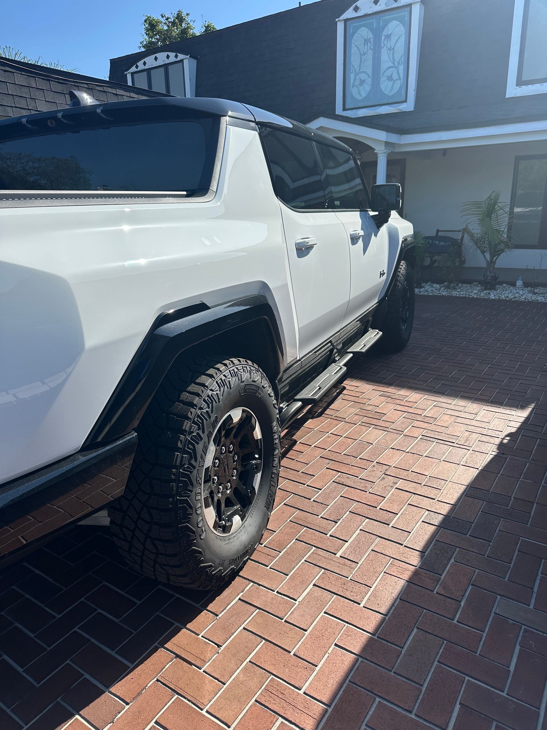 Passenger side of a white SUV type vehicle