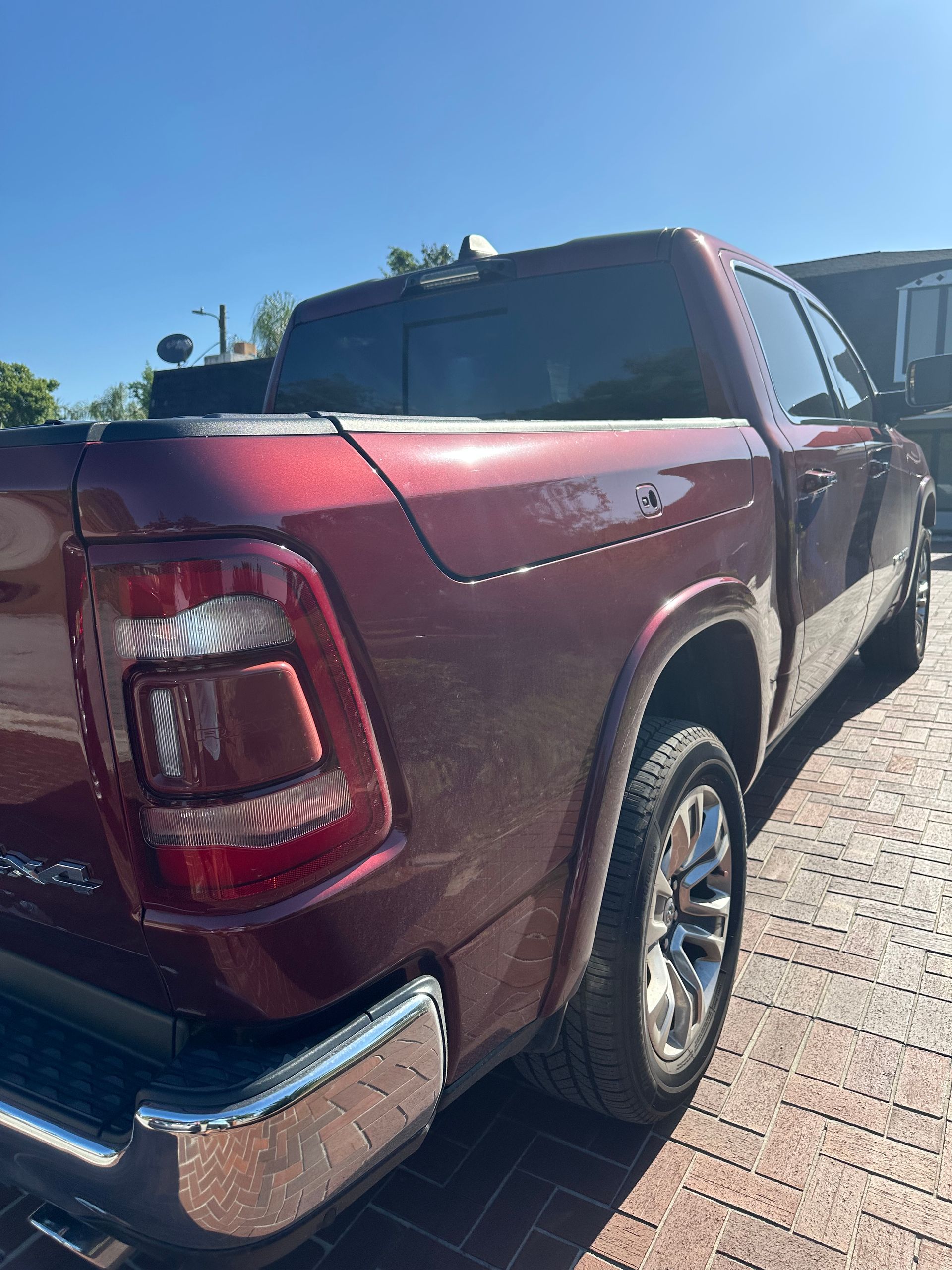 Passenger side or a red Ford truck from the back