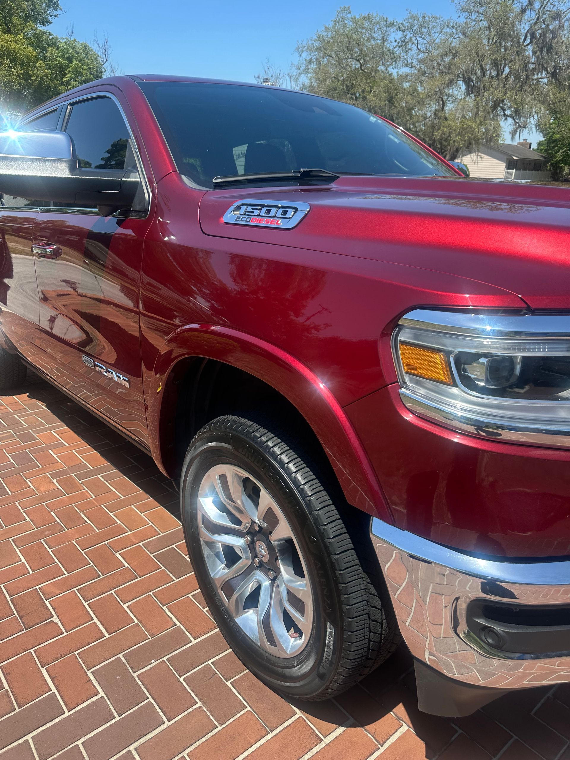 Passenger side or a red Ford truck from the front